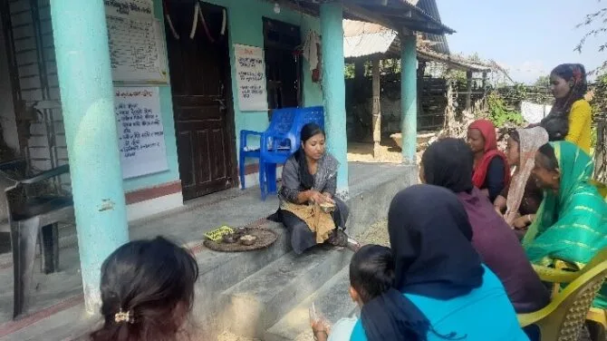 Mothers learning about nutritional foods from program staff